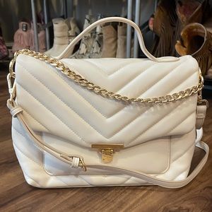 Cream/ivory messenger crossbody with gold chain.